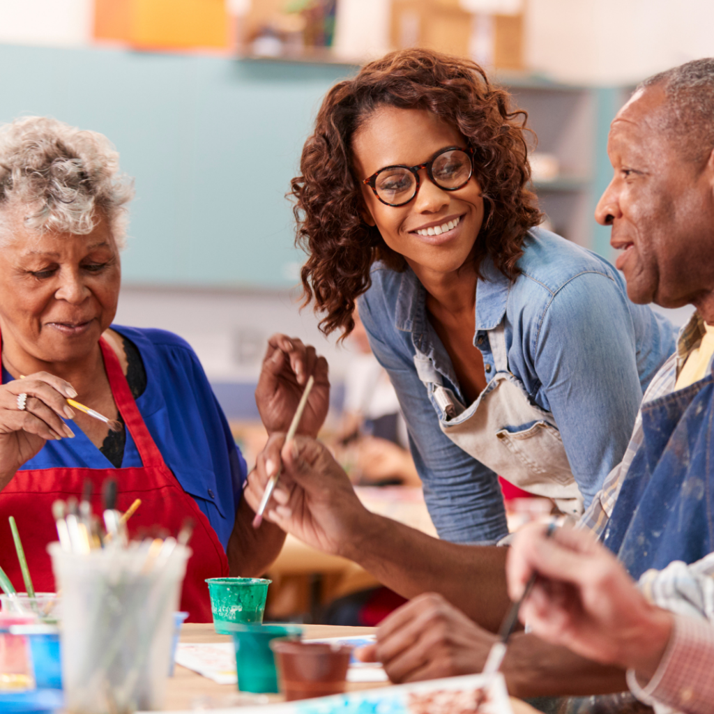 Participants engaging in a painting class, showcasing the joy of artistic endeavours.
