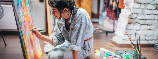 An artist sketching in a beautiful creative environment, showcasing creativity and inspiration.