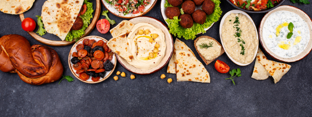 Global Traditions: table full of different cultural foods