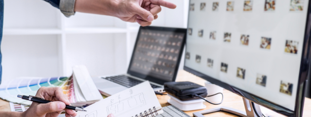 A Digital artist working on their artistic endeavours using a computer.