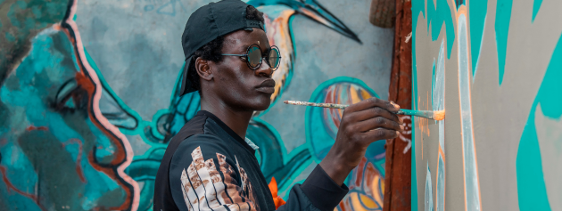 A colorful street mural representing cultural expressions and community stories.