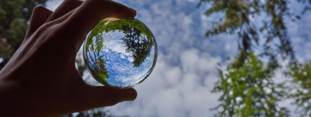 Life's reflection in a marble representing Personal Growth Stories